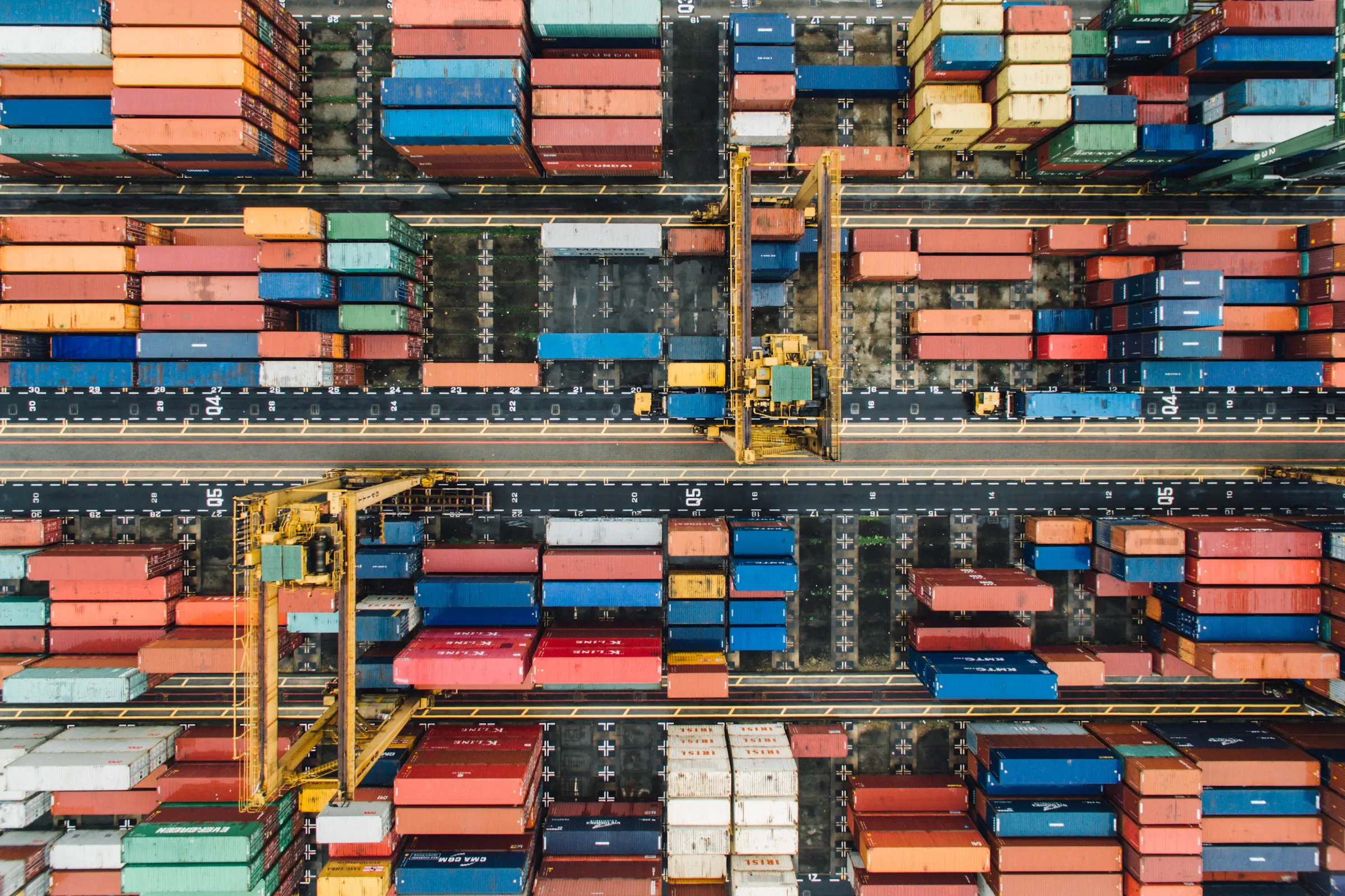 Aerial view of stacked shipping containers at a container terminal
